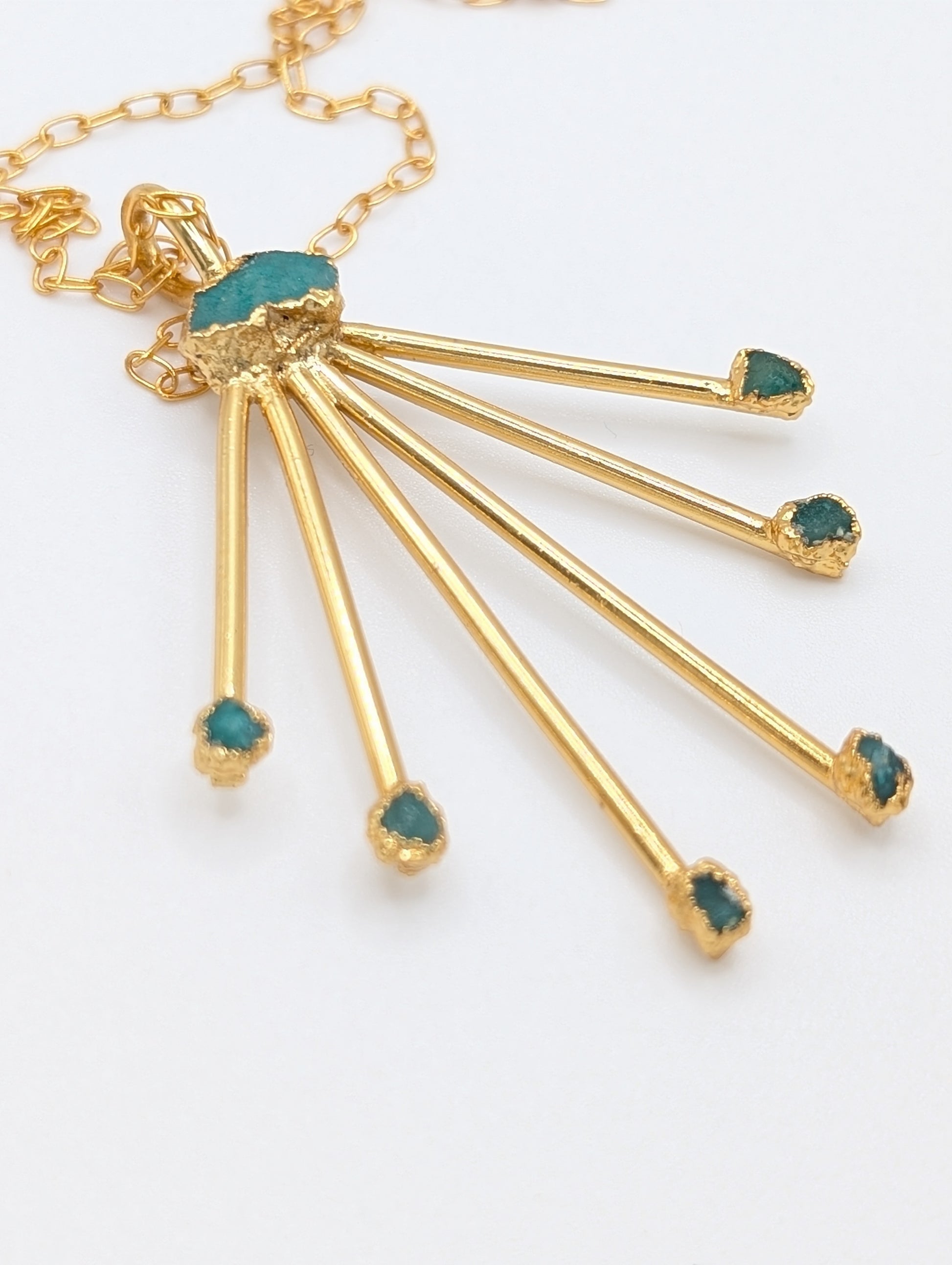 statement pendant gold necklace with emeralds
