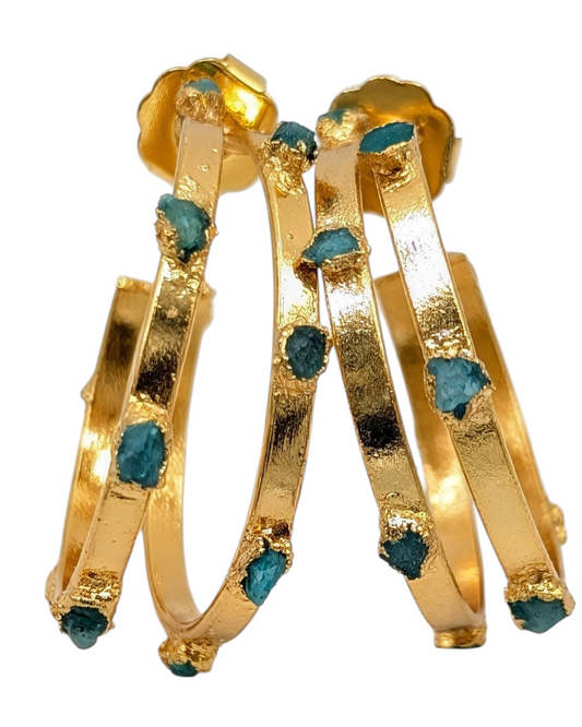 Gold hoop earrings with emeralds