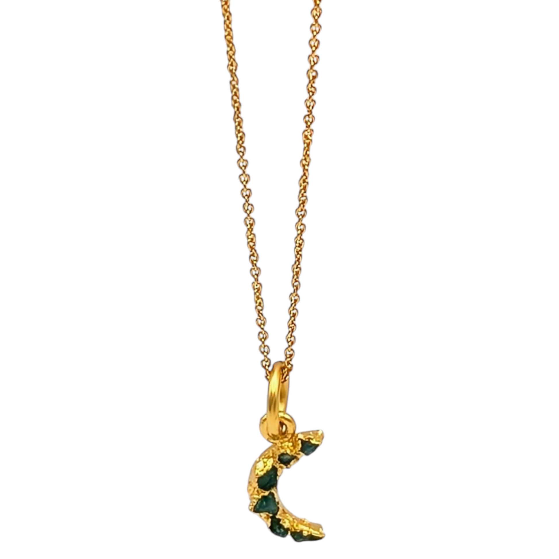 Gold plated necklace with a crescent moon pendant featuring Colombian emeralds
